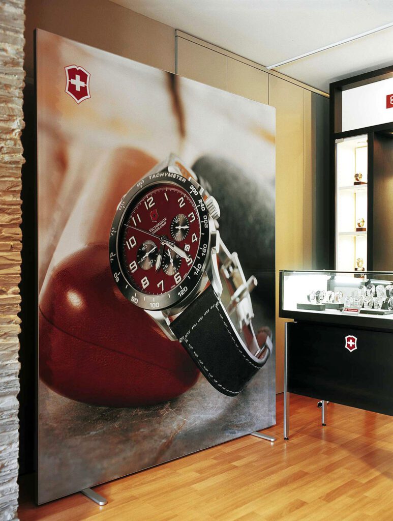 image primarily displays a large advertisement featuring a Victorinox Swiss Army Airboss Mach 6 watch